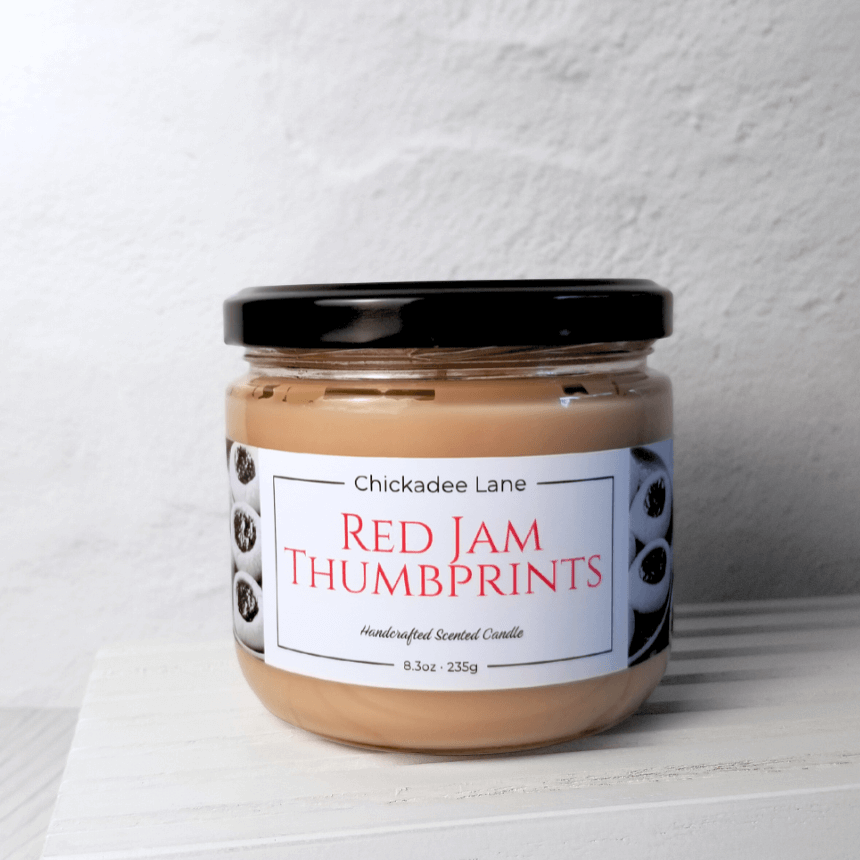 Product photo for Red Jam Thumbprint candle.